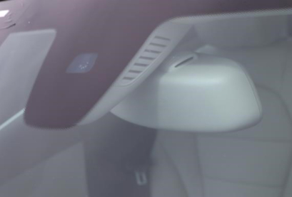 close up photo of a Mercedes-Benz windshield with a rain sensor